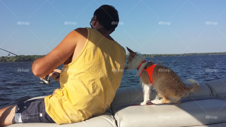 A Man and his Dog. fishing in Wisconsin  with a pup