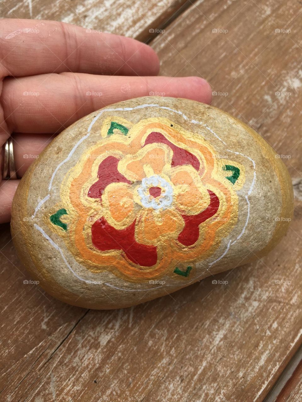 A perfectly painted rock, to share a little bit of art and kindness around the community. This is a Tudor Rose. Hand painted by me.