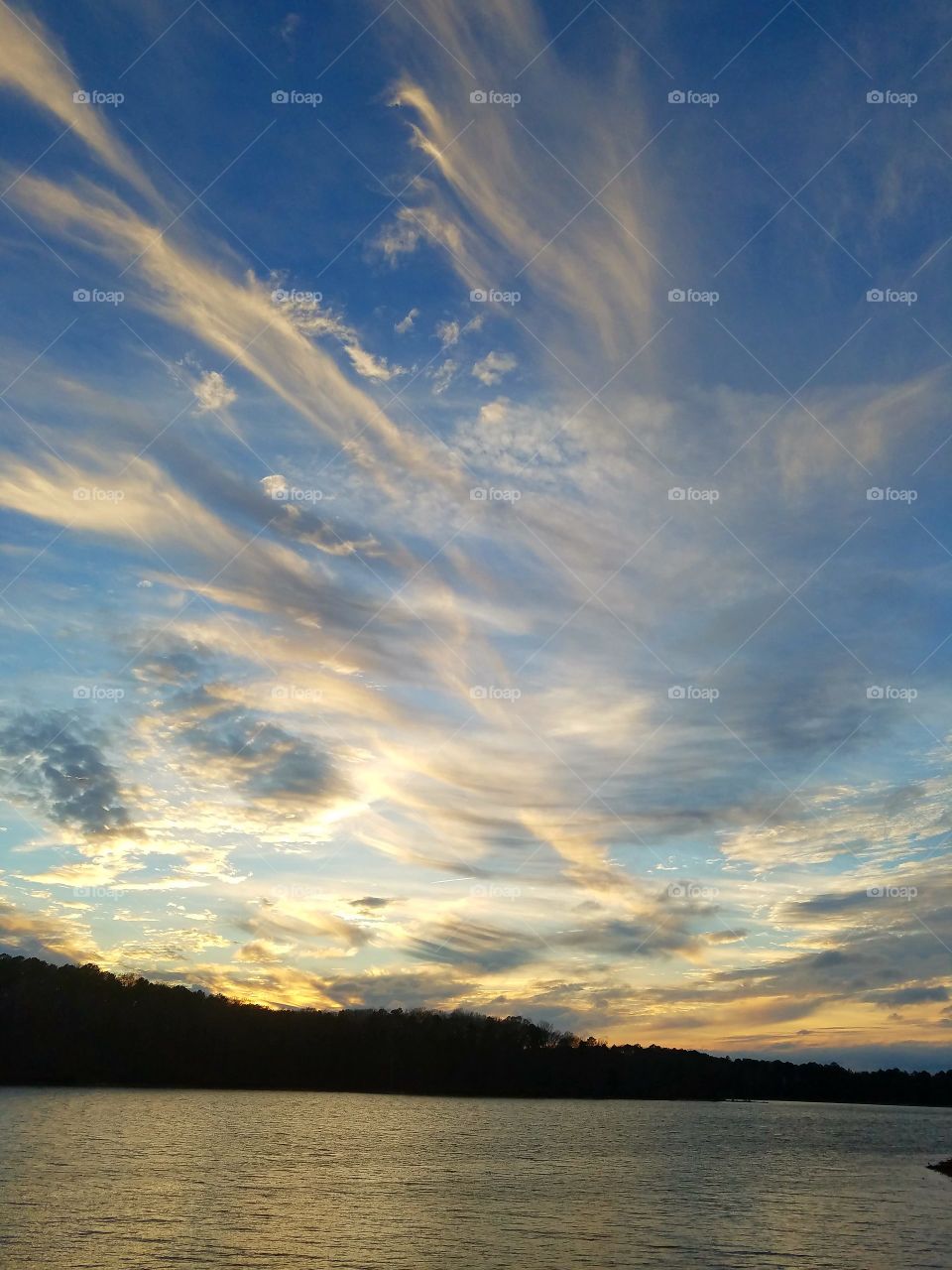 clouds and sunset on christmas eve on lake.