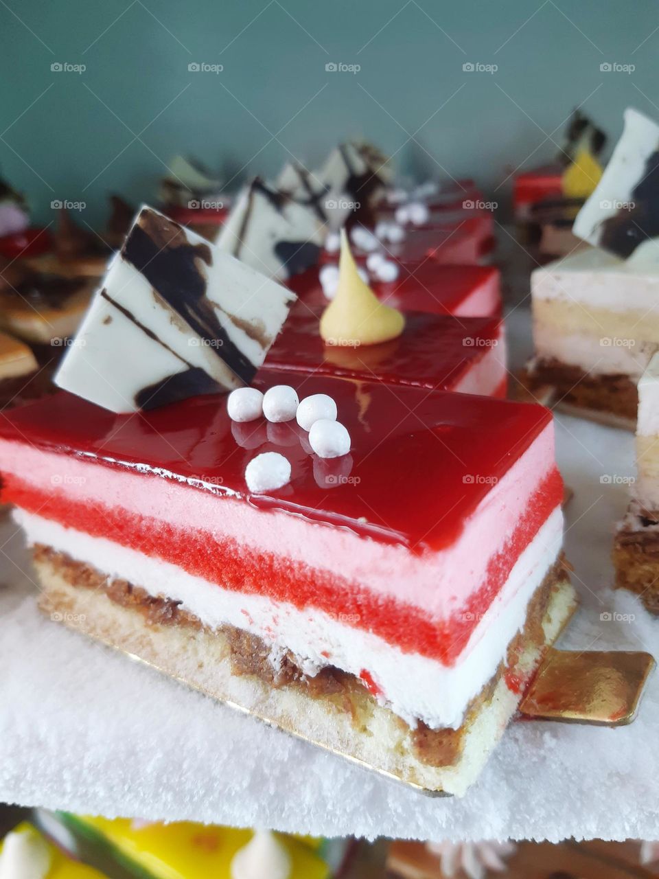 "Crème Fraîche Framboise" desserts are a type of French treat that features fresh ingredients like crème fraîche and raspberries (framboise). The dessert typically consists of layered, smooth whipped cream or fresh cream, combined with the tangy flav