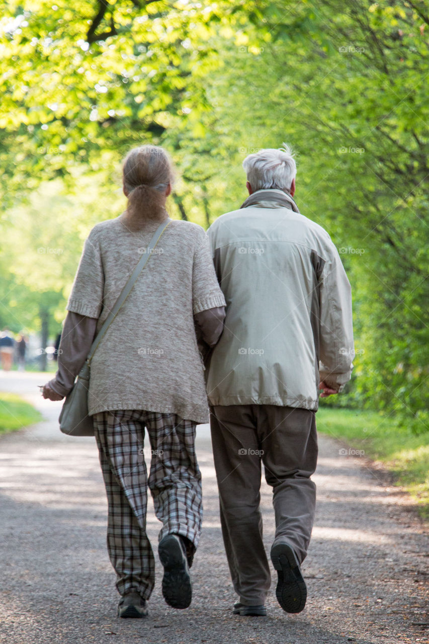 Old couple walking on the street