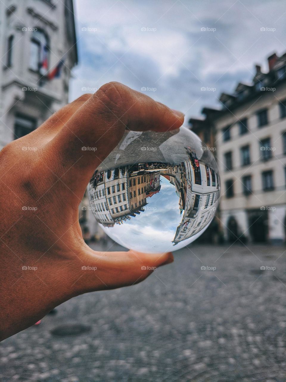 Top view of lensball,  crystal ball at the Adriatic seaside against sunset sky close up