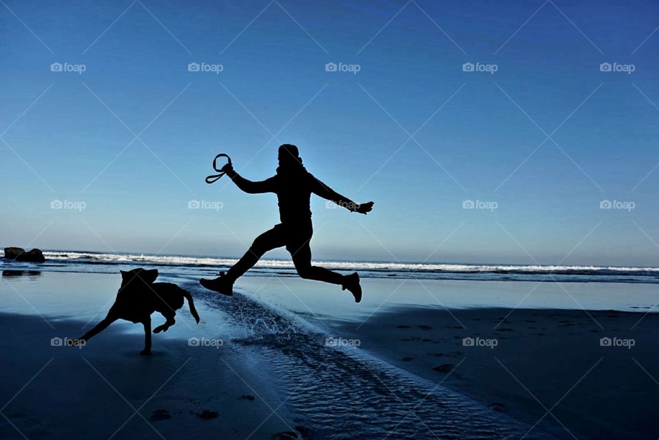 Beach#sunrise#ocean#sky#human#dog#jump