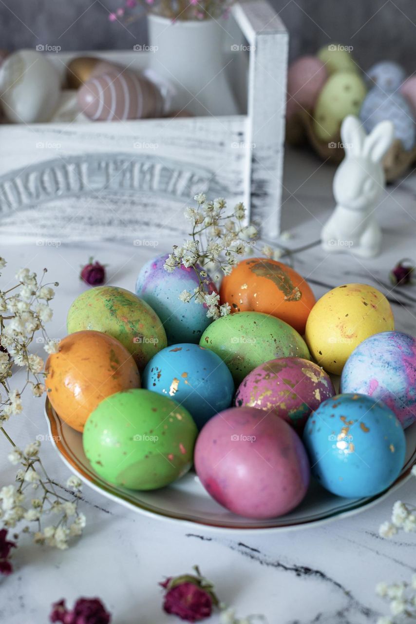 Easter traditionally colored eggs and rabbit 