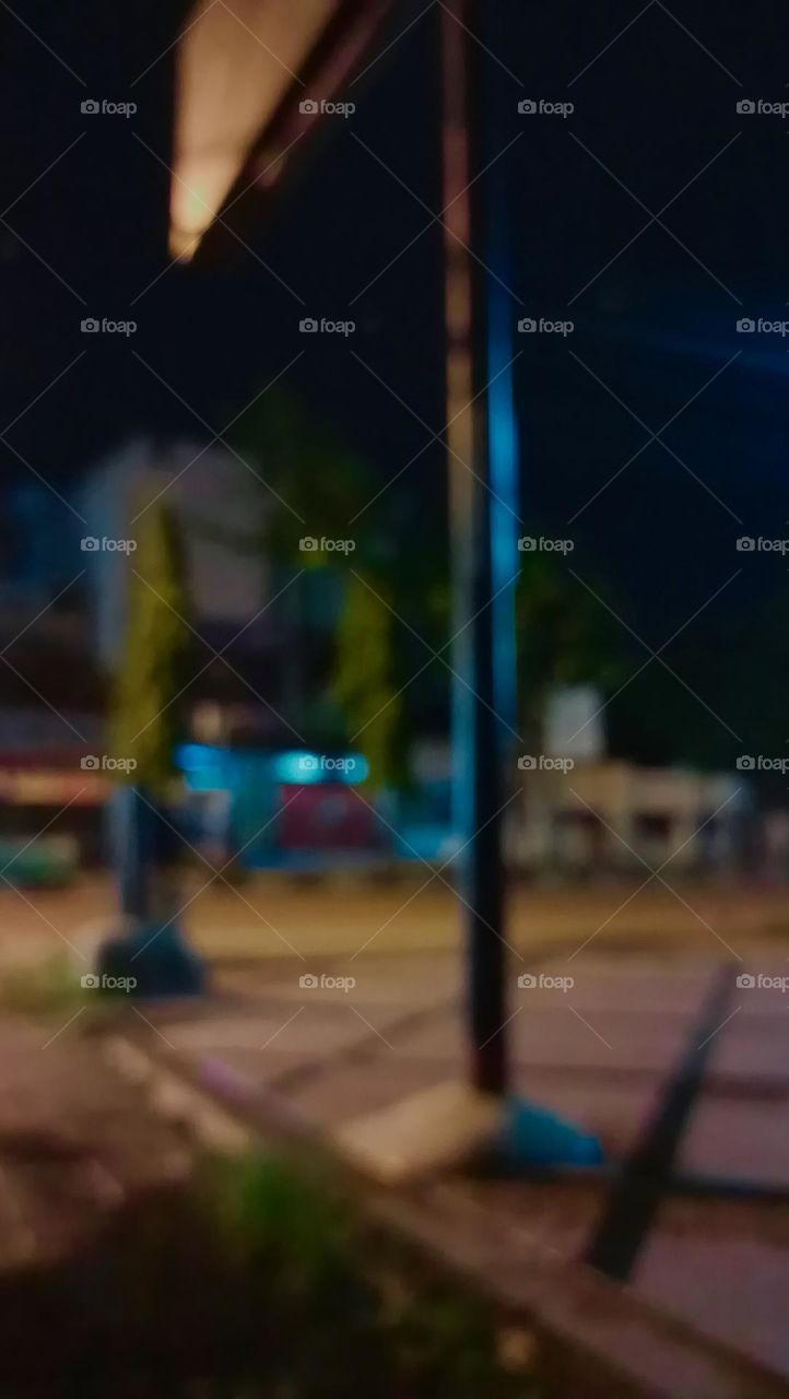 Defocused abstract background of city street at night with street lamp lighting. 
Blurred cityscape,Lighting night at tourist attraction colorful.