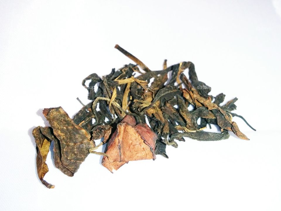 Tea leafs on white background
