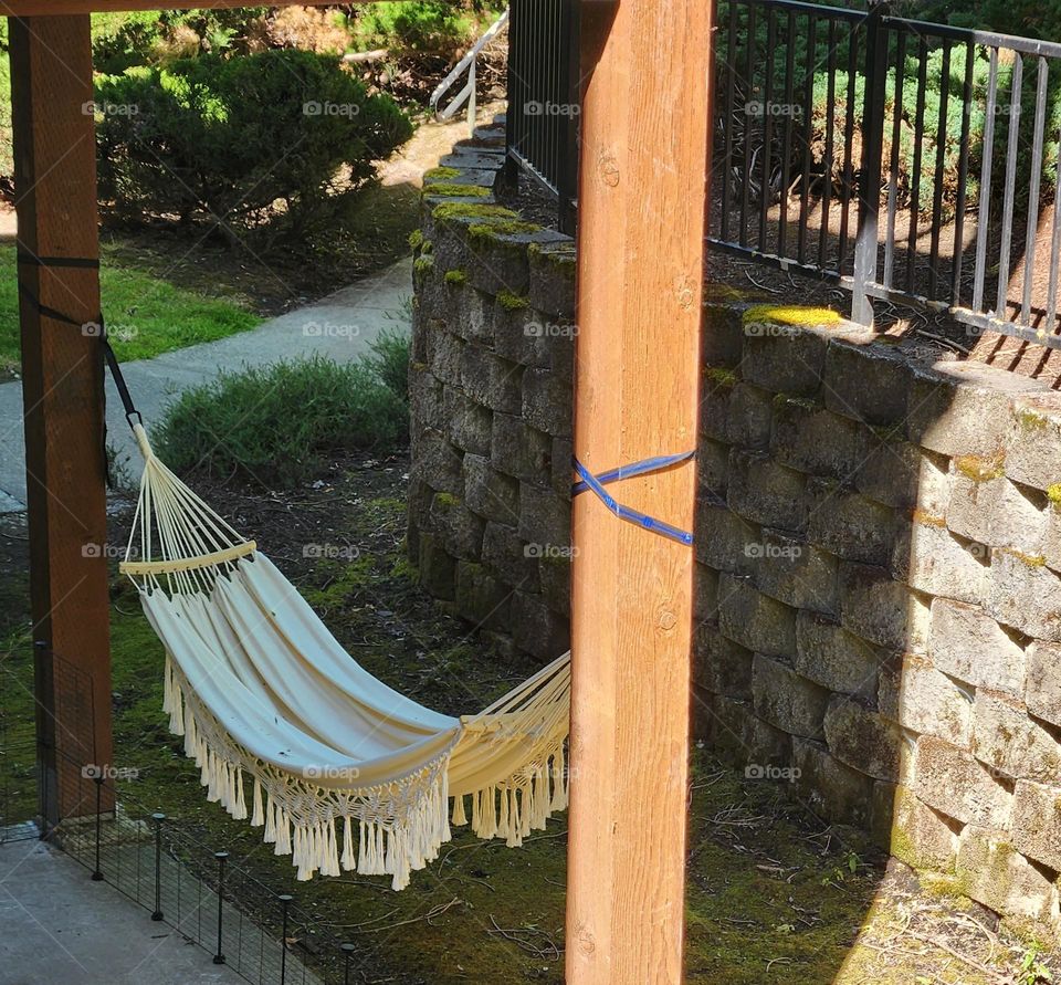 shady white hammock quiet outdoor resting place on ground floor of an apartment complex in Oregon