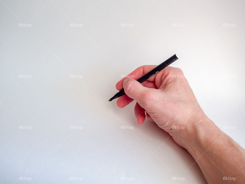 The person holds in hand the handle on a white background for record on an interview of the ideas for business.