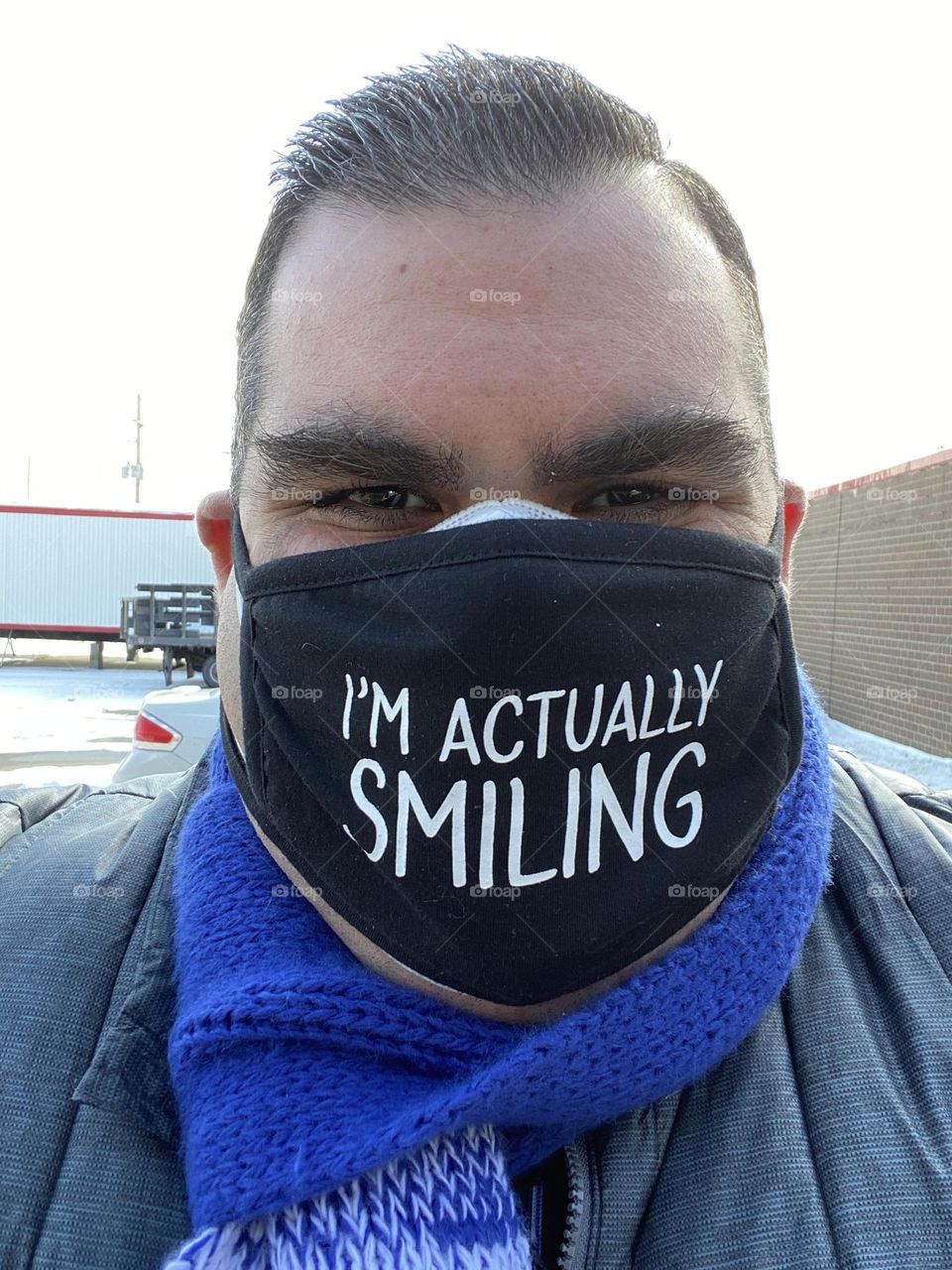 Picture of person smiling in face mask