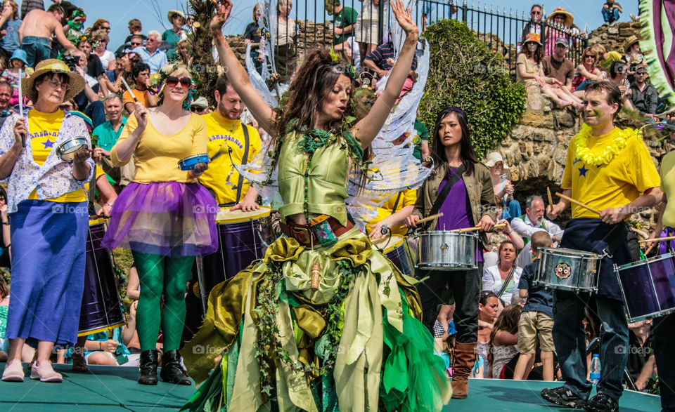 A woman dances on stage to music from a samba band, at Hastings Traditional Jack in the Green, U.K. 2008