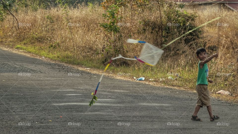 Kid with flying kite