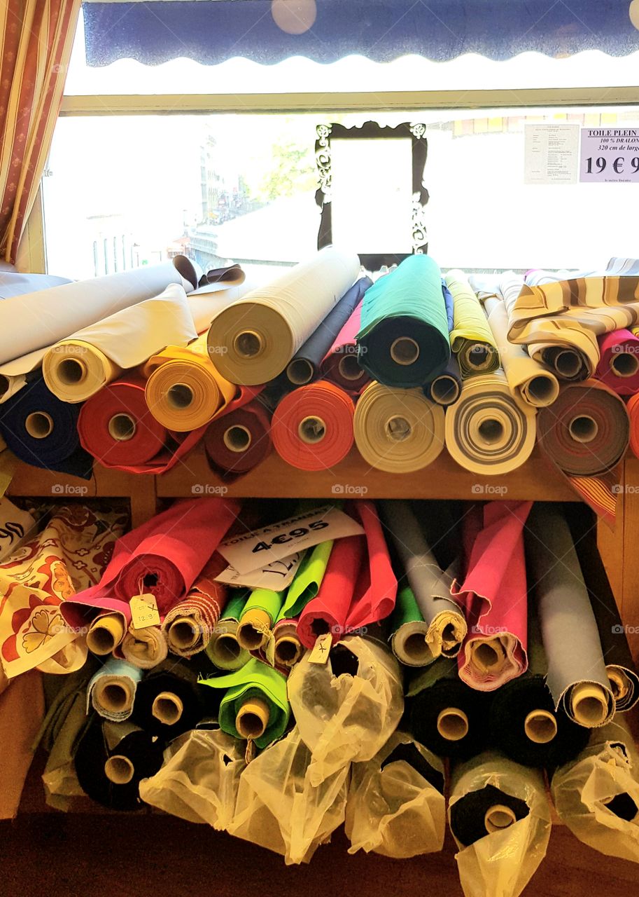 Plenty of fabric rolls at Marché saint pierre in Montmartre in Paris
