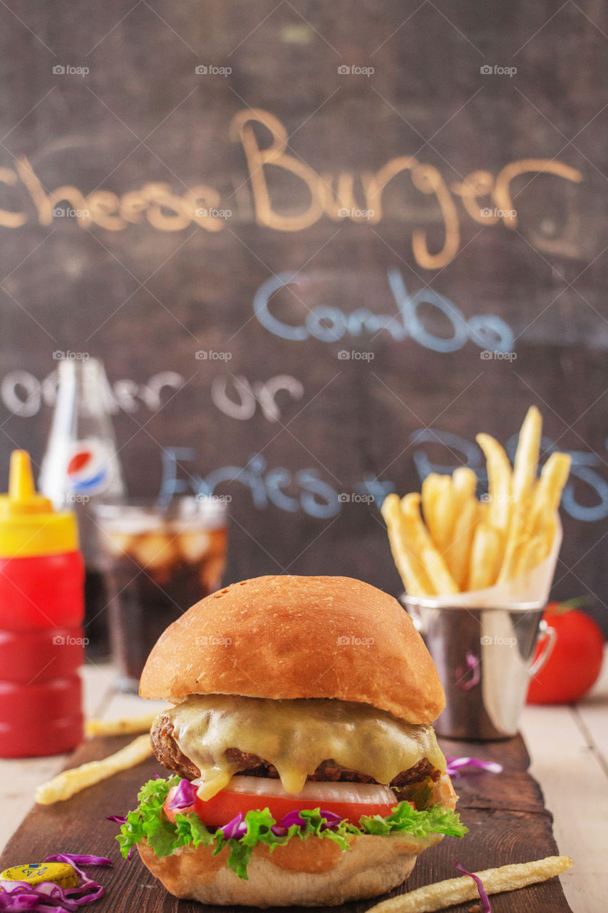 Burger sandwich, fries and Pepsi