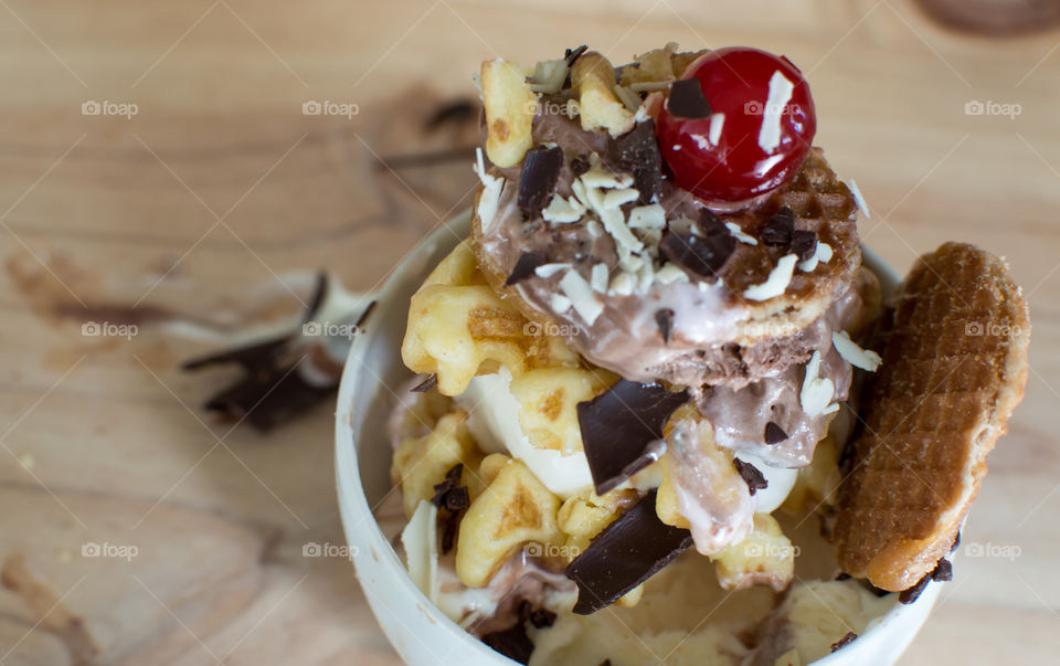 Waffles layered with chocolate and vanilla ice cream