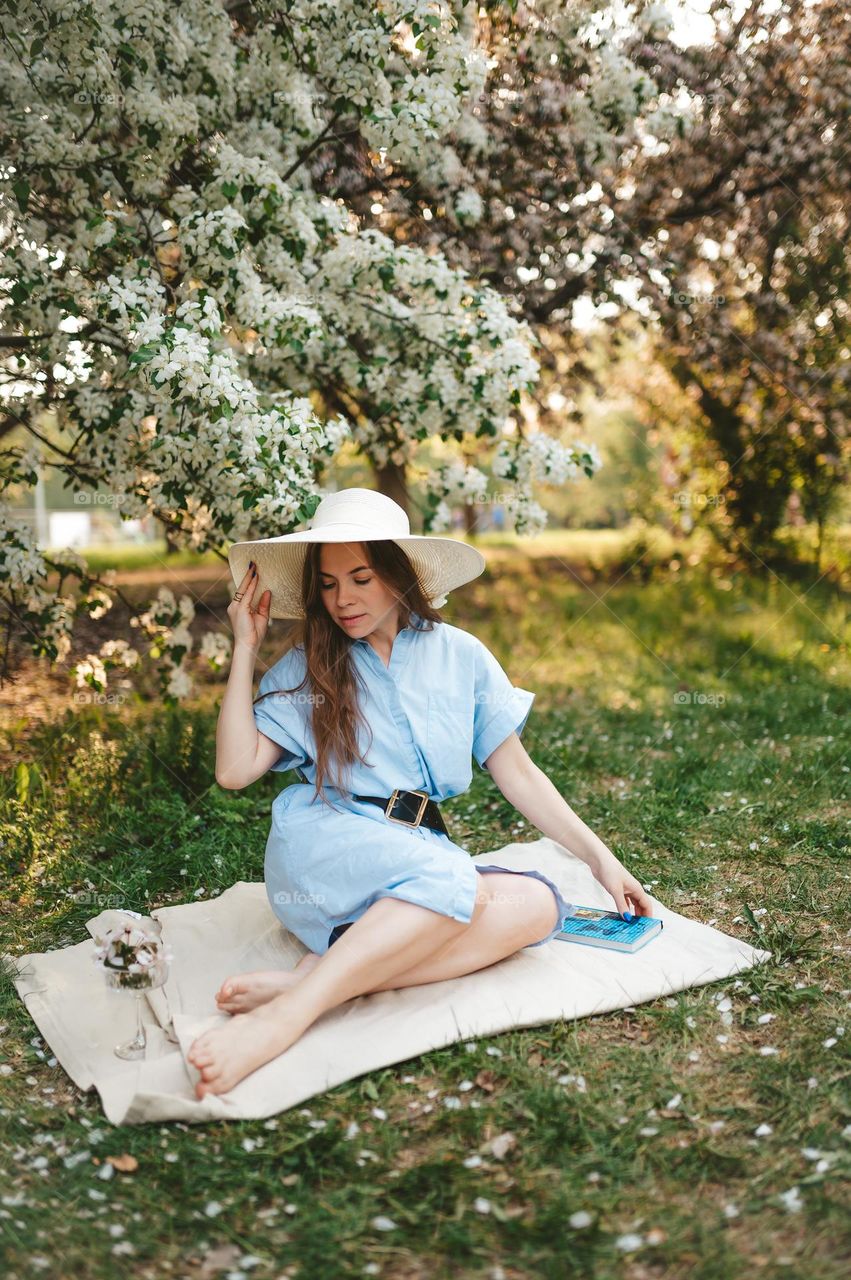 Beautiful woman on the picnic in the park 