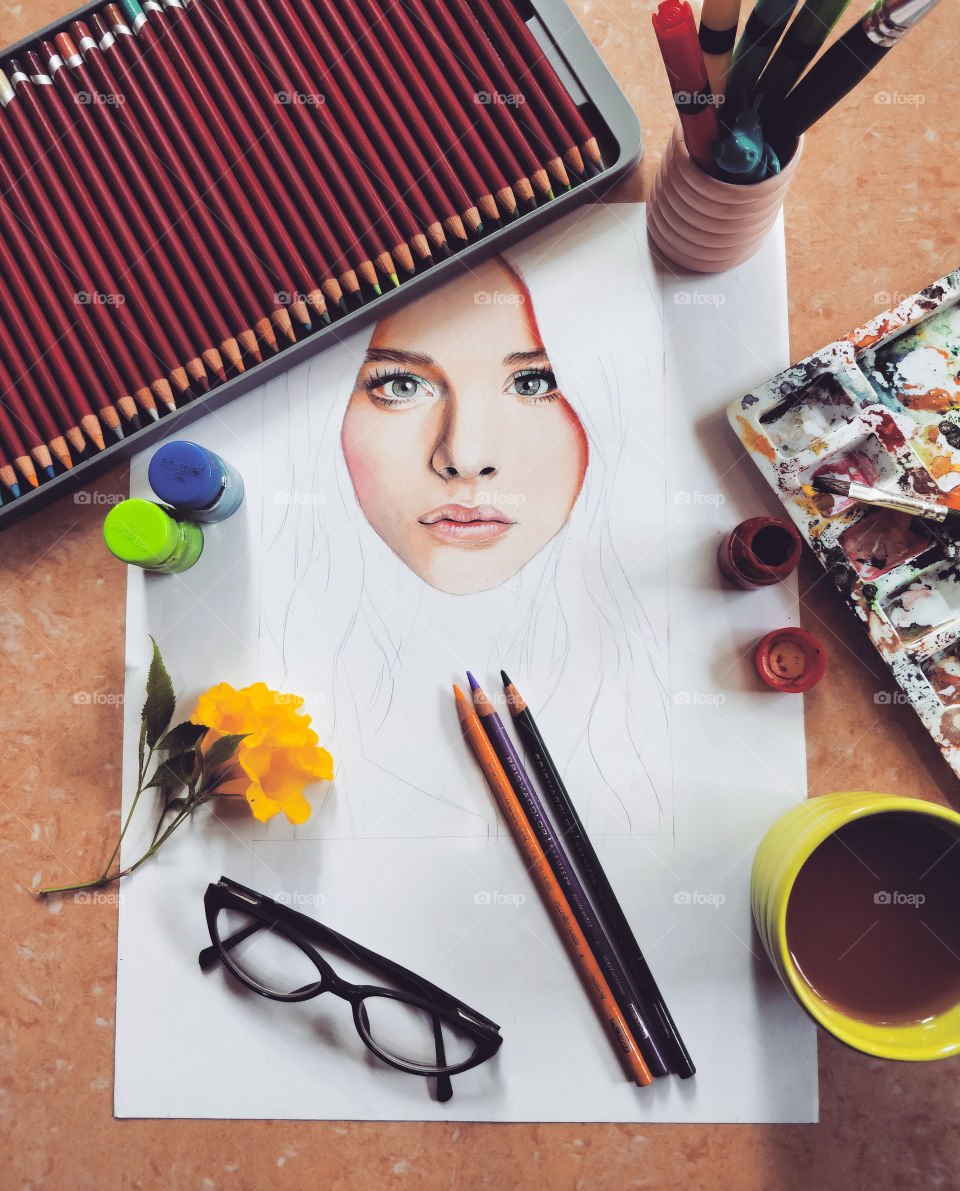 flat lays of items of a young portrait artist