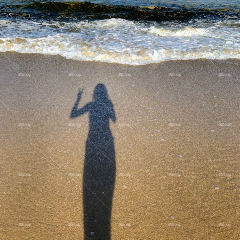 Shadow on the beach sand