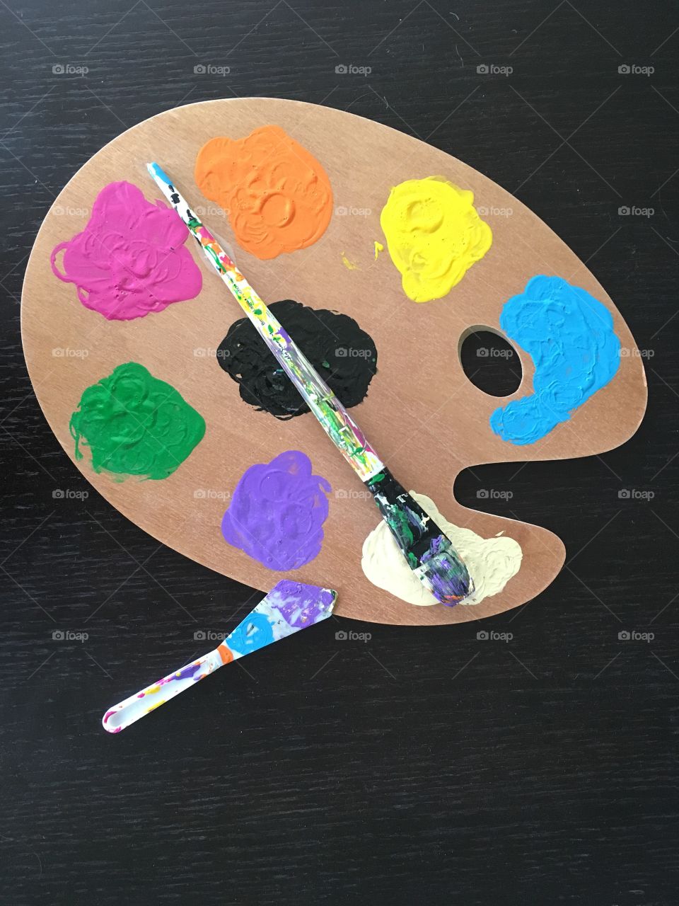 Painters palette and tools and paint brush