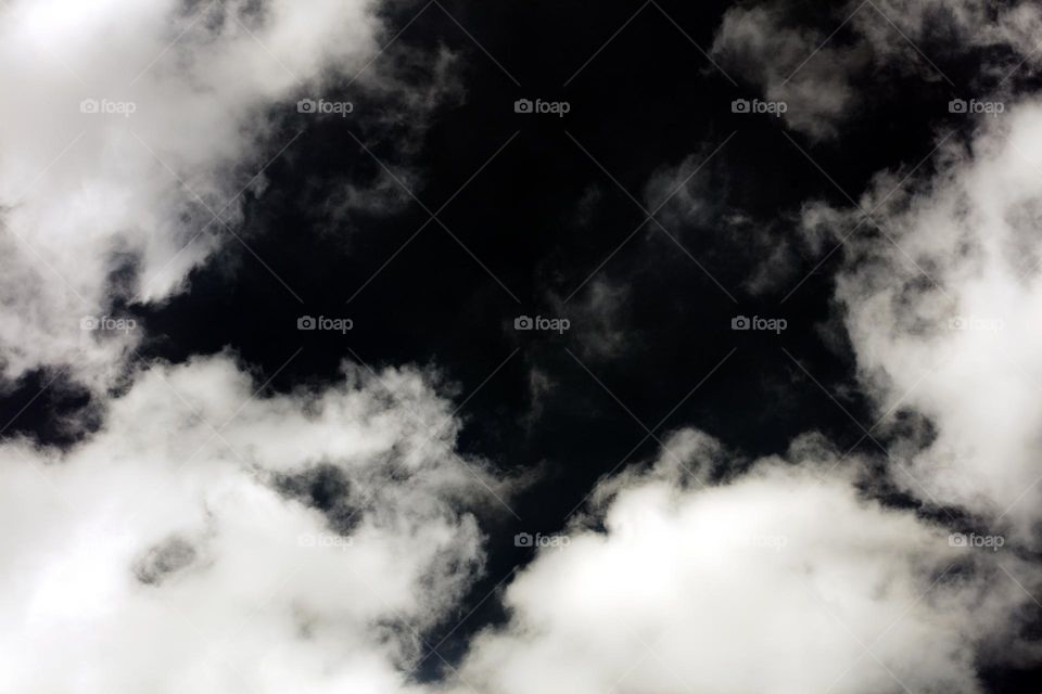 Black sky with clouds trippy psychedelic minimalistic background winter season daydreaming