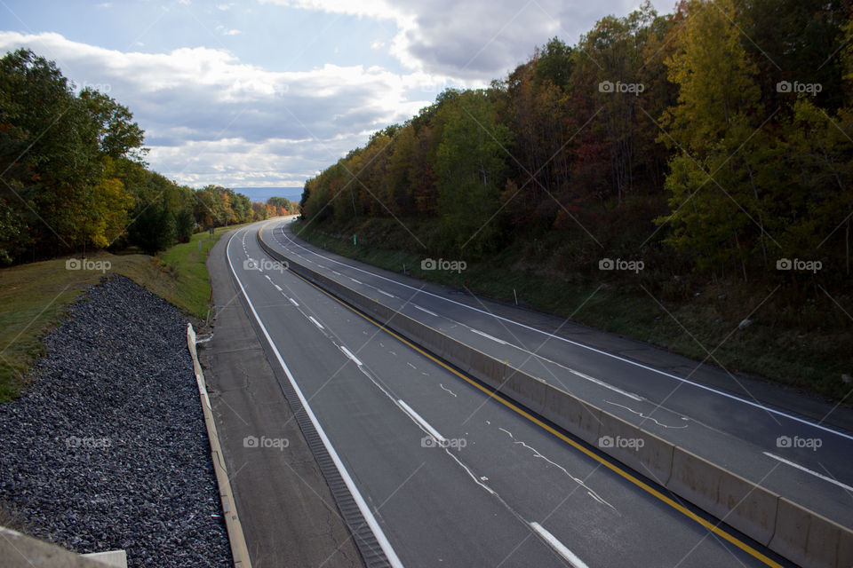 Highway through Fall. This is one of the views I have when running up a mountain and over this bridge.