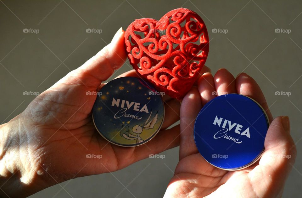 love Nivea, cream in the female hands