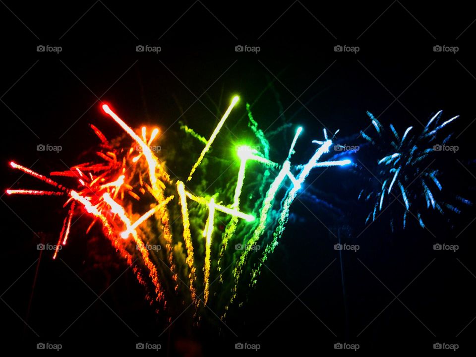 Bright fireworks shooting into the sky.
