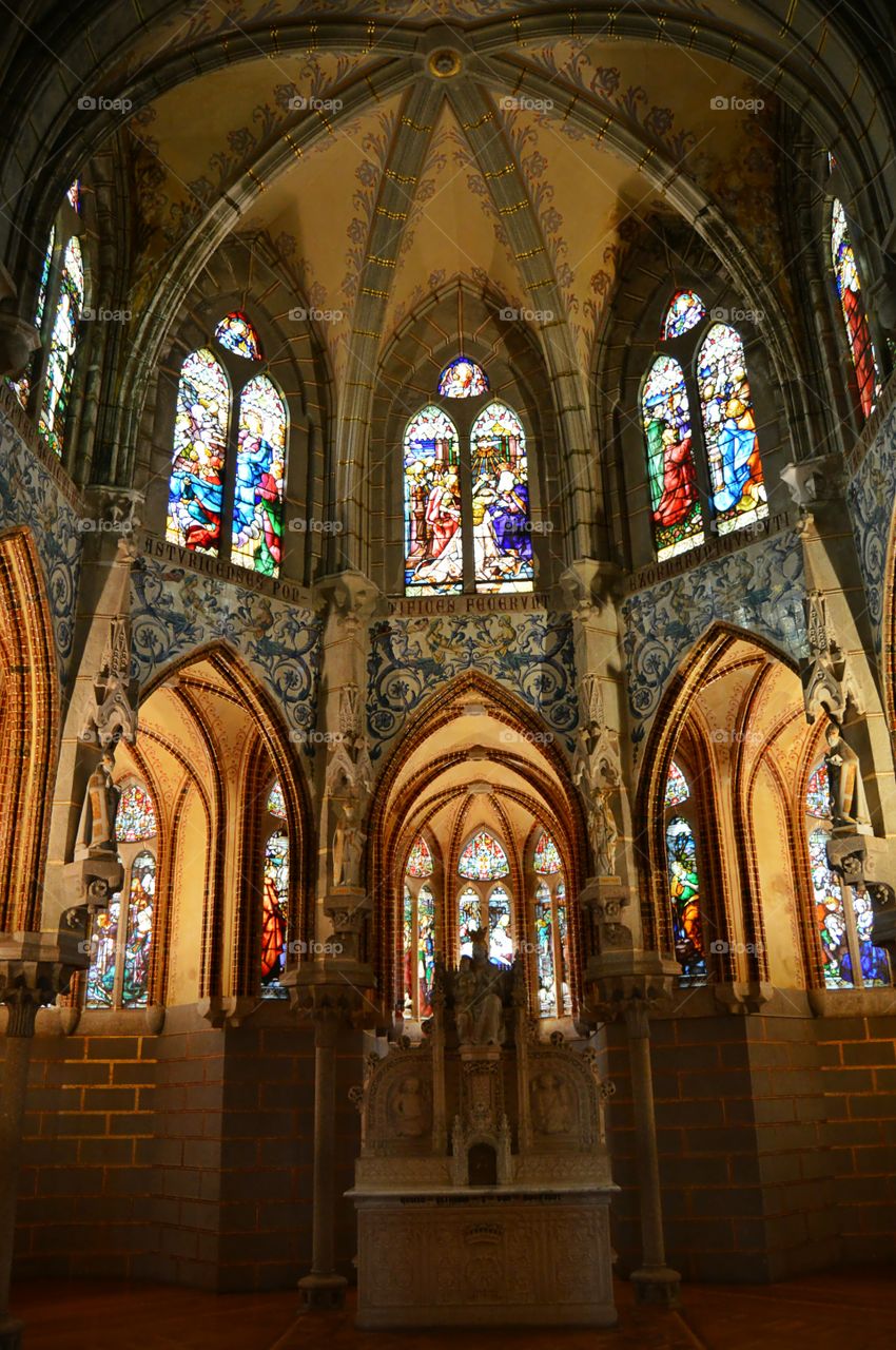 Altar and stained glass window. Altar and stained glass windows at Episcopal Palace of Astorga, Spain.