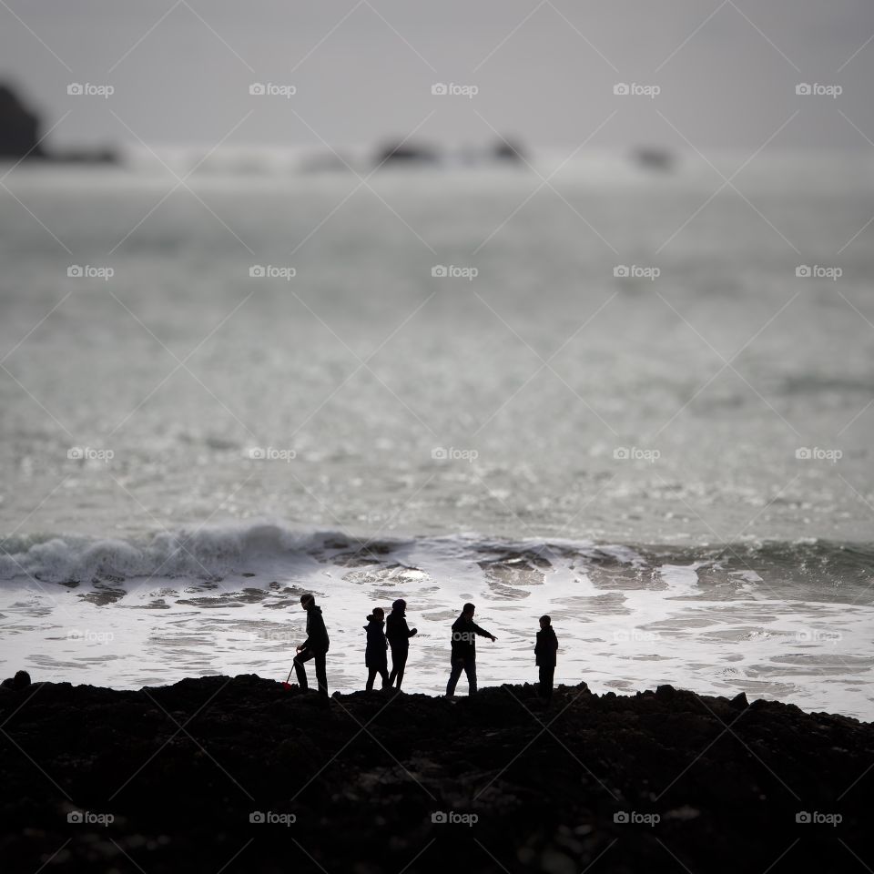 Seaside Silhouettes. A family of five on an adventure at the seaside as it starts to get dark.