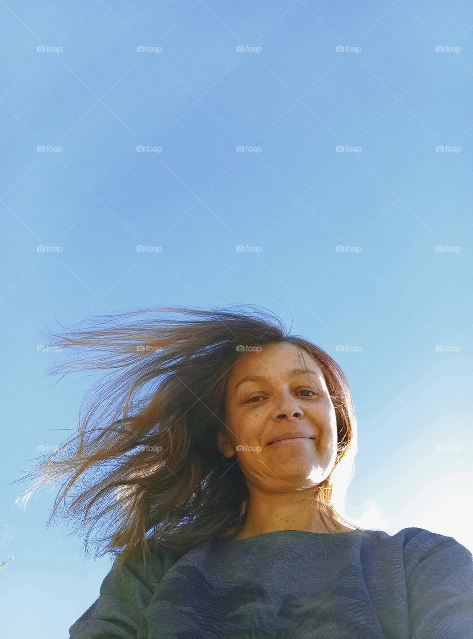 brunette natural hair woman, spring nature