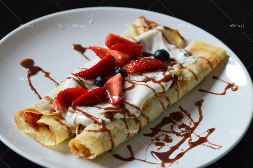 Pancake with cream in plate