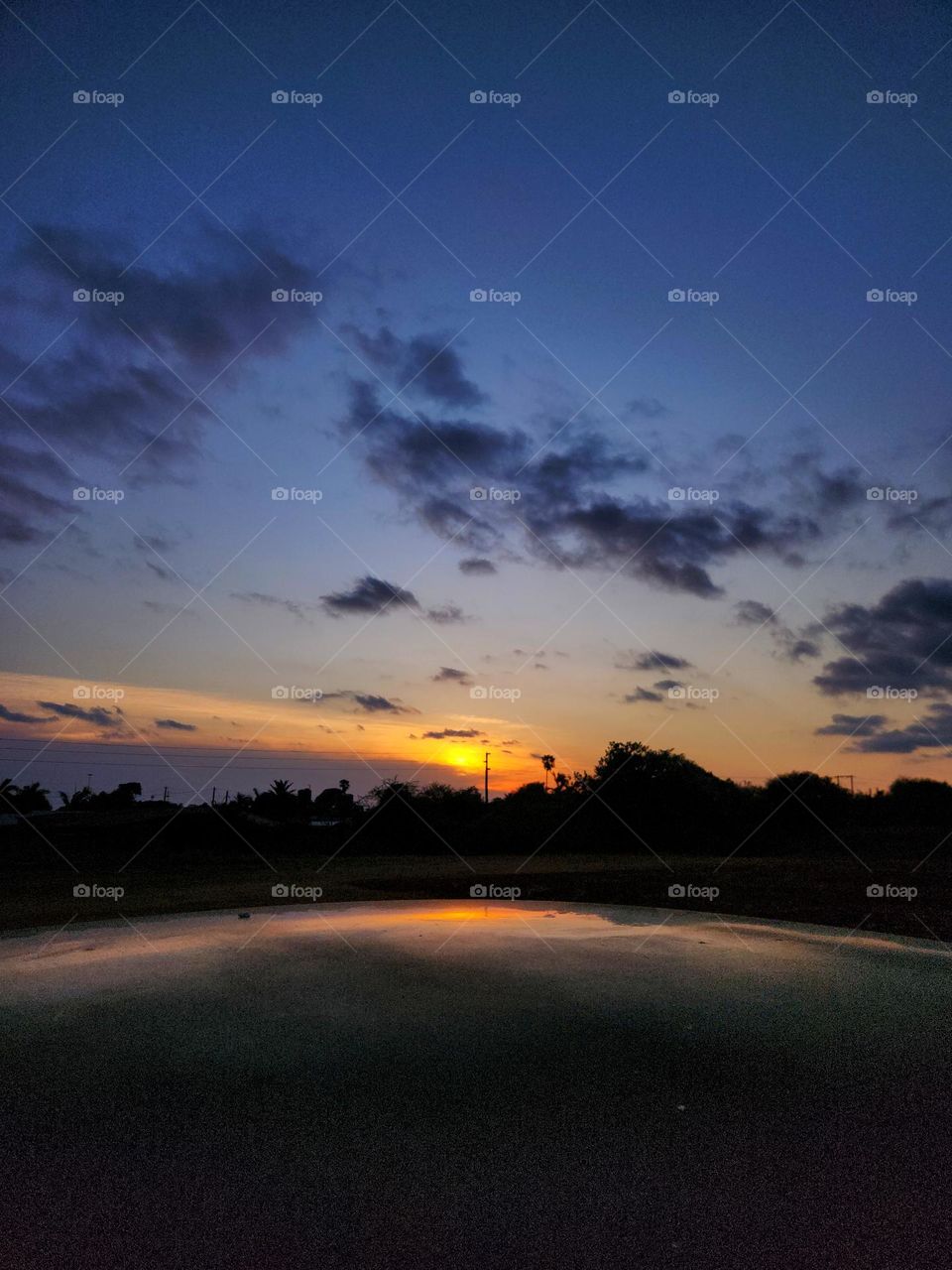 Sunset with reflection on a car roof