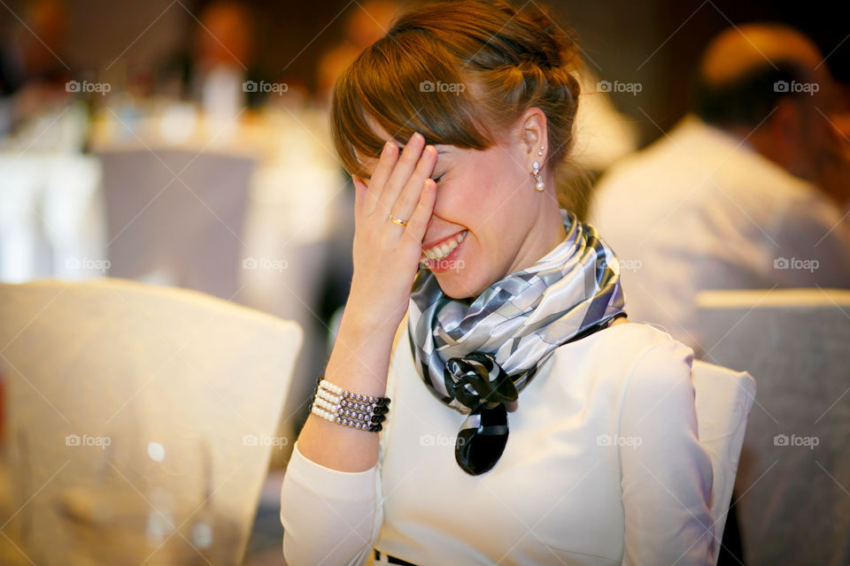 What makes you smile?
girl laughing covering her face with her hand