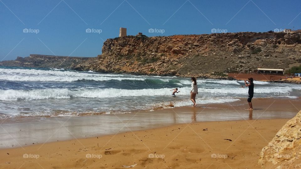 waves on a beach in Malta