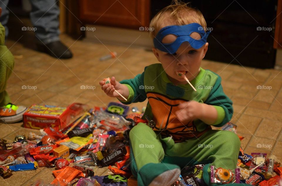 Portrait of a child sitting in chocolates