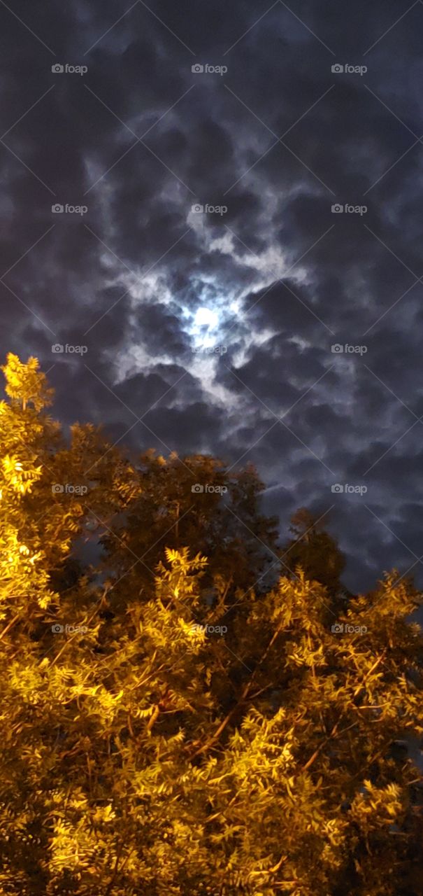 Moon behind clouds