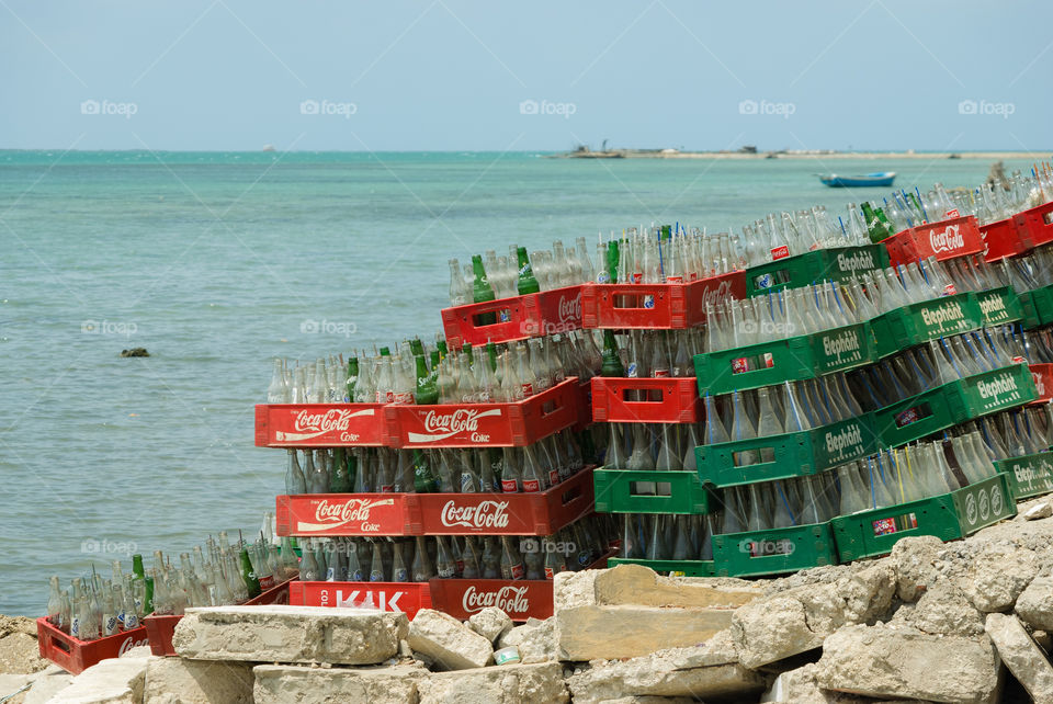 sea empty bottles coke by vidu
