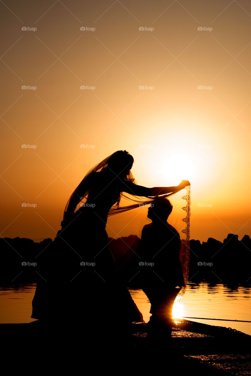 Love sunset. Just married couple during sunset