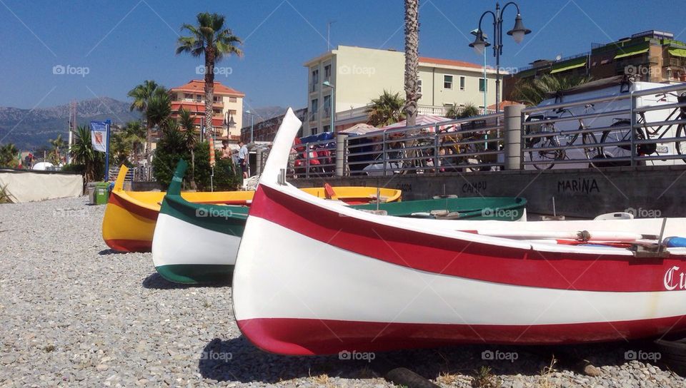 Rowing boats on a beach in Ventimiglia, Ligura, Italy.