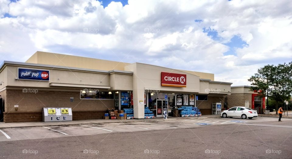 Circle K Store and gas station with bright white clouds.