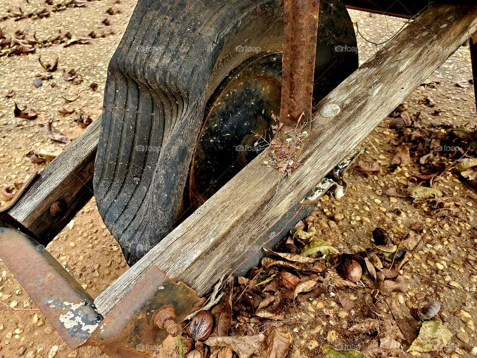Wheelbarrow with a flat tire and wooden frame