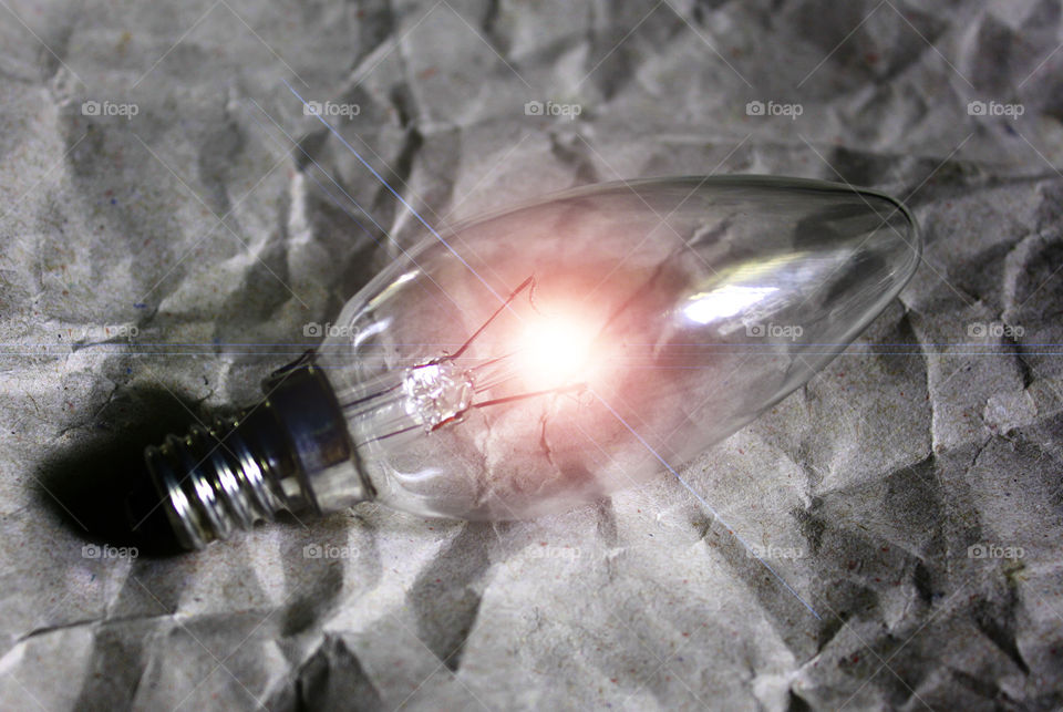 A bulb on a paper background 2
