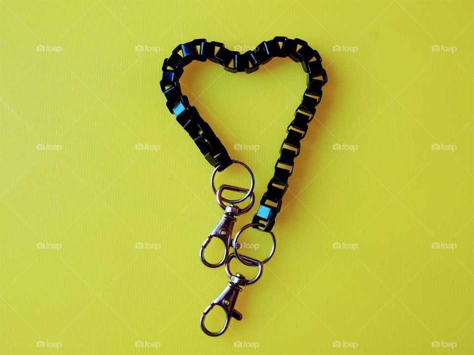 love symbol black chain and yellow background