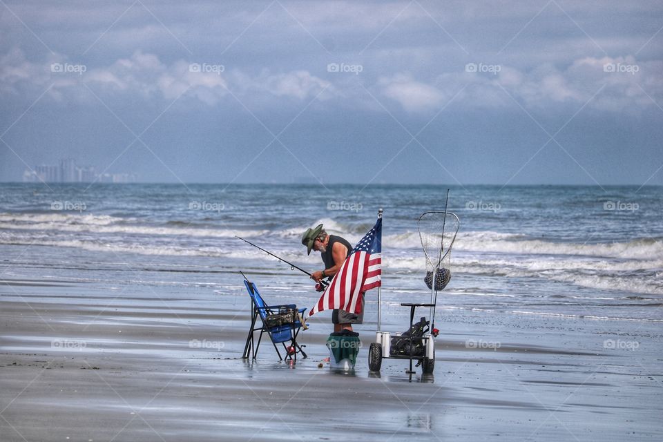 patriotic fisherman on the beach