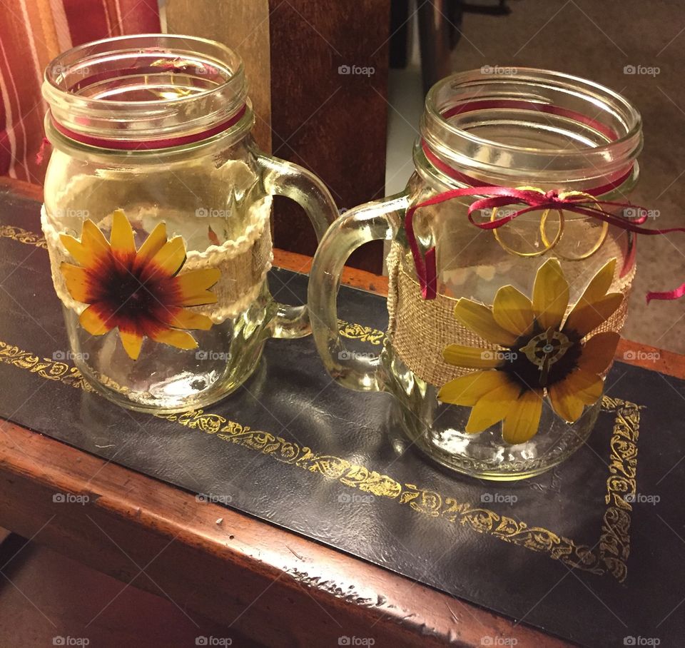 Glass mugs decorated with  sunflowers  for a wedding toast.