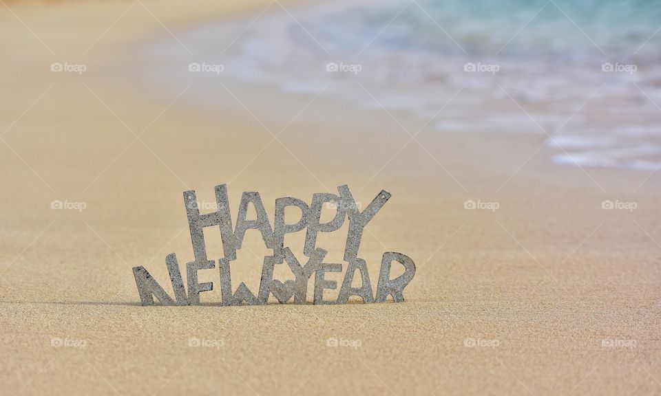 happy New year sign on the beach on fuerteventura canary island in Spain