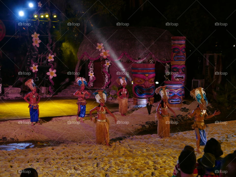 Male and female dancer in traditional costume at night