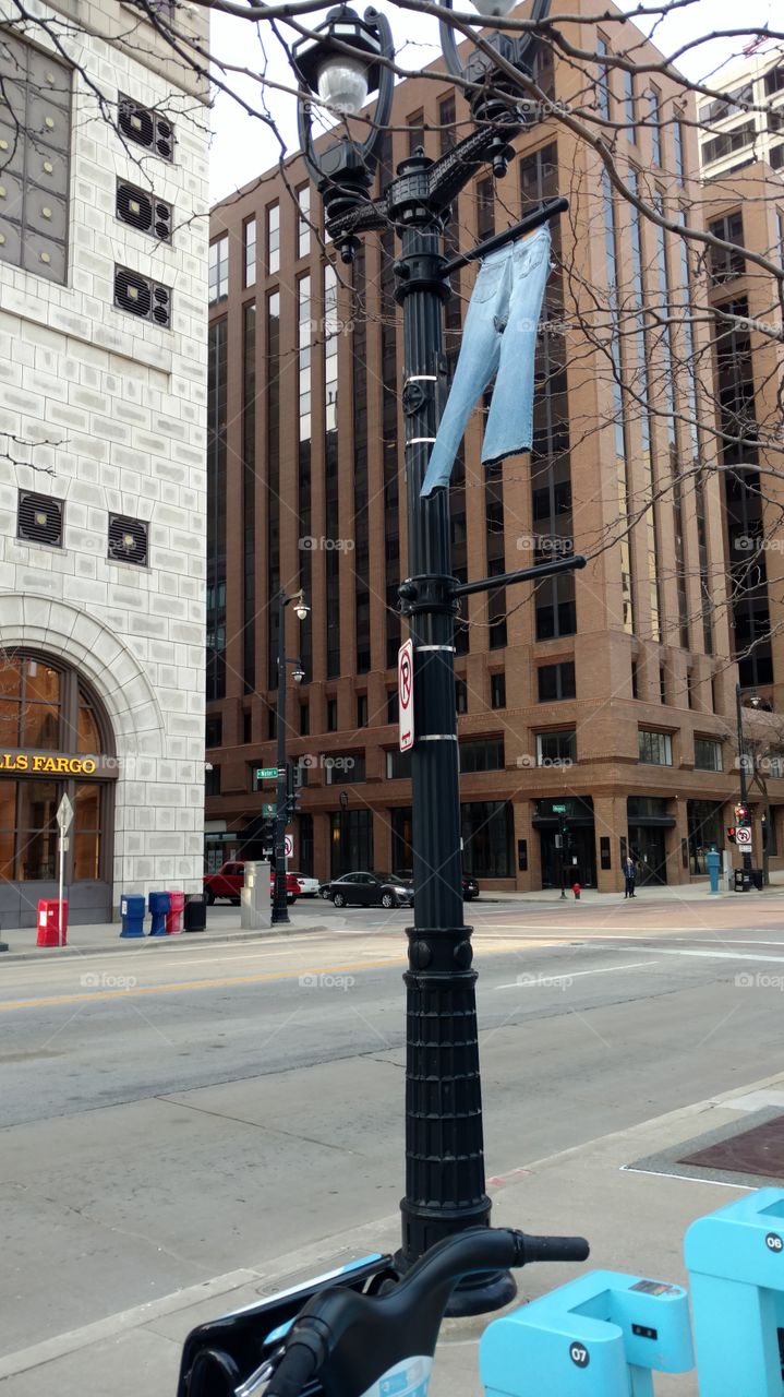 A pair of jeans on a streetlight in Milwaukee, Wisconsin