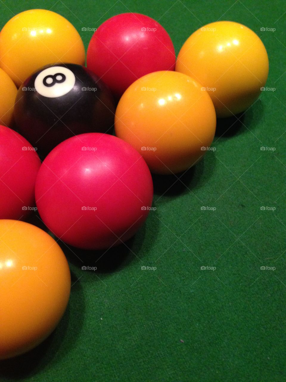 Pool table on green felt table