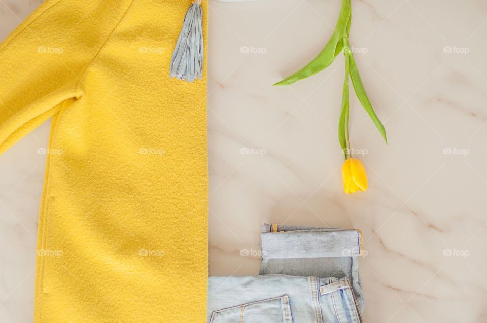High angle view of warm clothing and yellow flower