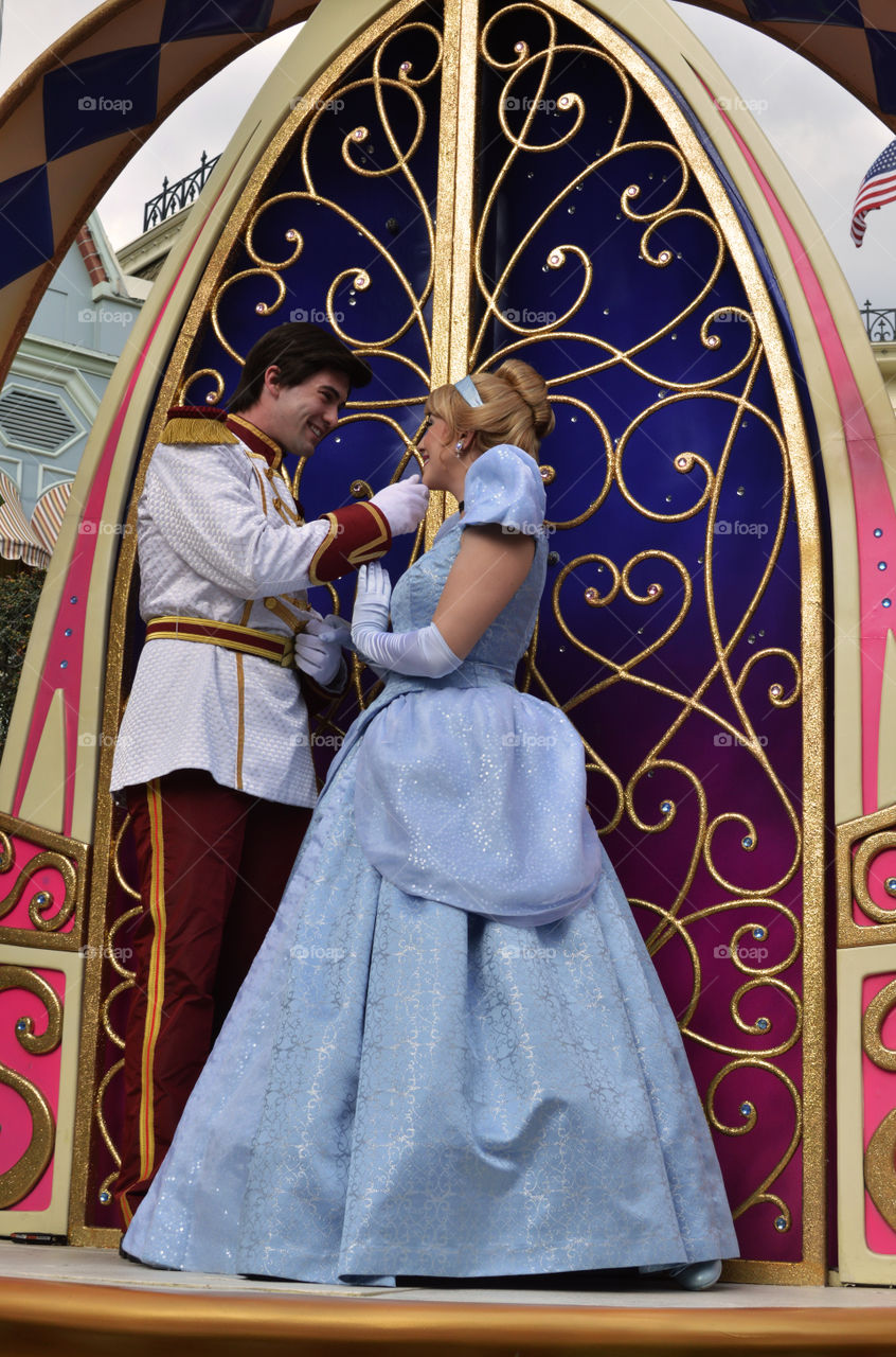 Couple in costume standing near door